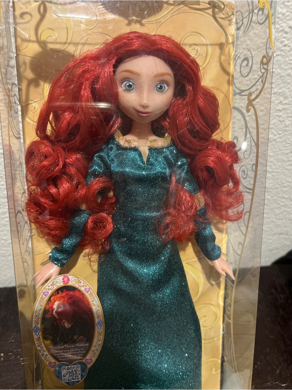 Disney Doll with Vibrant Red Curly Hair and Shimmering Teal Dress